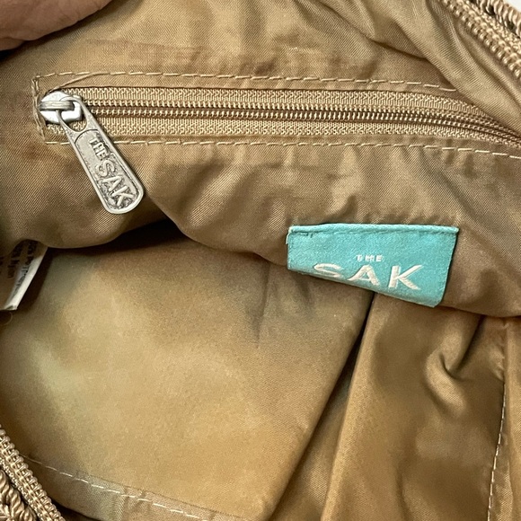 The Sak Crochet Shoulder Bag in Cognac color. Crochet Flower detail on zipper. - Picture 10 of 10